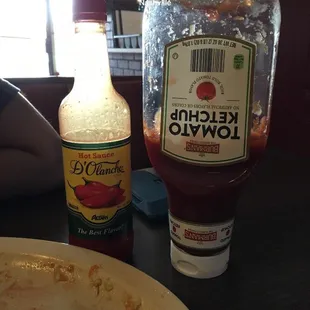 a plate of food and a bottle of ketchup