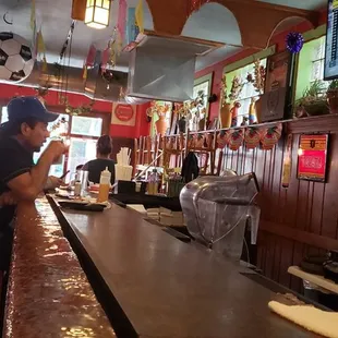 a woman sitting at a bar