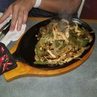 a person stirring up a dish