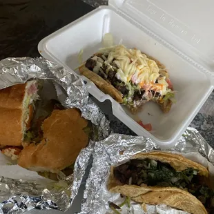 two sandwiches in tin foil