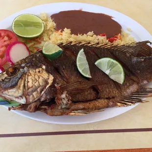 Friend fish with rice vegetables  this is my favorite meal here.