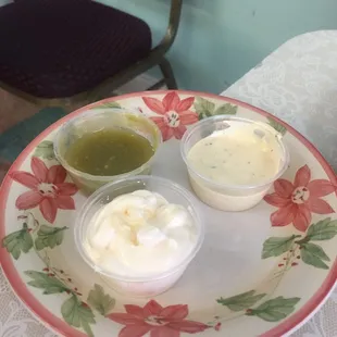 a plate of dips and sauces