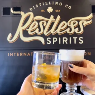 two people toasting glasses of beer