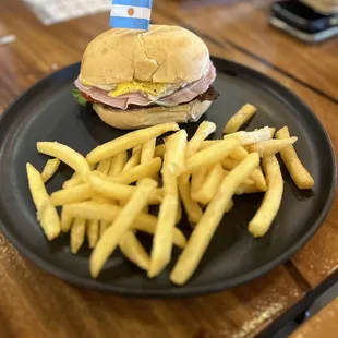 a plate with a sandwich and french fries