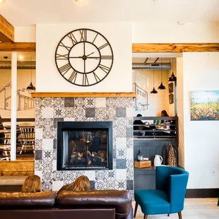 a fireplace with a clock above it