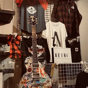 a guitar and t - shirts