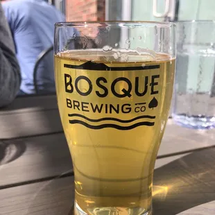 a glass of beer on a table