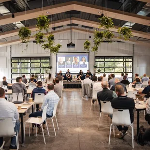 a large group of people sitting at tables