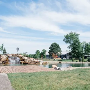 a view of a pond and a waterfall