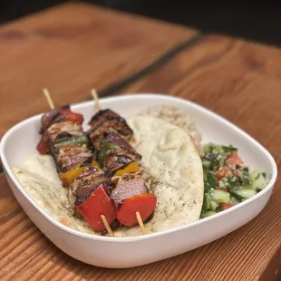 Chicken Skewers with tabouleh, pita and rice