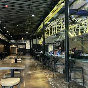 Bar with color changing harbor bridge and large glass floor/ceiling panel
