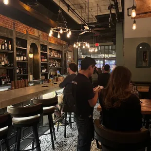 a group of people at a bar