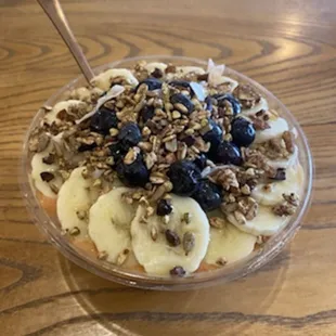 a bowl of fruit and nuts