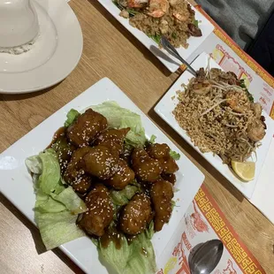 Shown: Pad Thai - Reuan Thai's Special, fried rice house combo, Sesame Chicken with steamed white rice on the side.