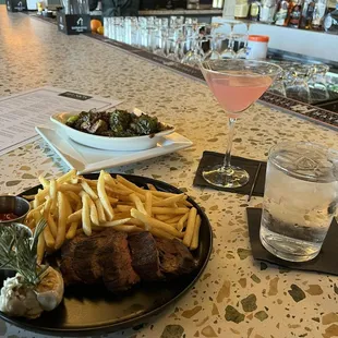 steak frites with shareable brussels sprouts and cosmo martini