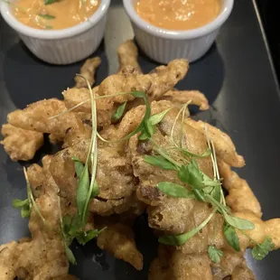 Vegan Tempura Oyster Mushrooms with spicy dipping sauces.