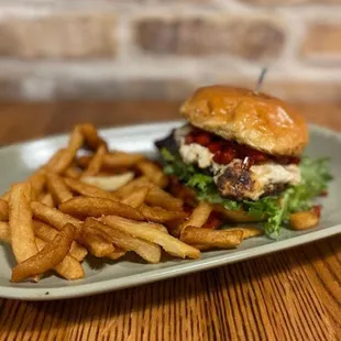 a burger and fries on a plate