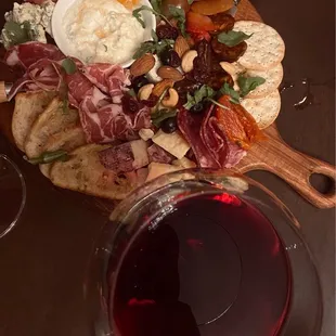 a plate of food and a glass of wine