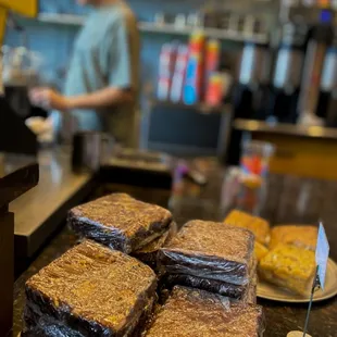 a counter with a variety of pastries on it