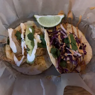 two tacos in a basket on a table