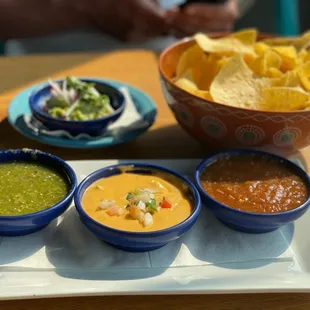 Chips, salsa, queso and guacamole