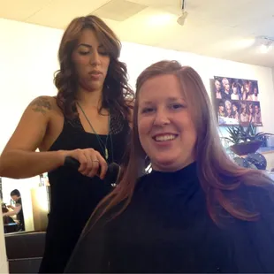 Monika adding layers to Sarah's hair