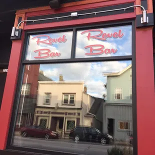 the reflection of a car in the window