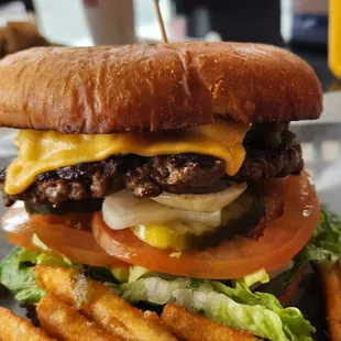 Very tasty burger with cheese + green chile added. Mighty fine!!!