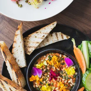 a plate of food with bread and salad