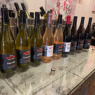 bottles of wine lined up on a table