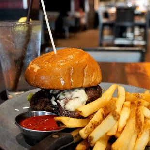 Forbes Burger: brisket, cheese curds, fried onion, Miller's mustard on brioche with beer cheese dip ($20). Upgrade chips to fries for $1.