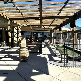 Patio Area with Rollup Garage Doors, TVs and Cornhole Games
