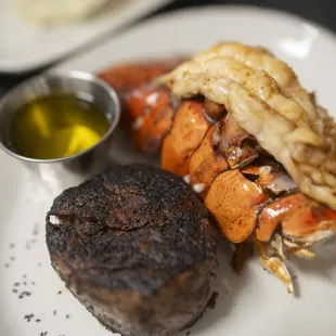 a steak and lobster on a plate