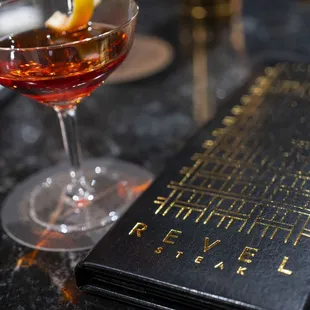 a cocktail in a coupe glass