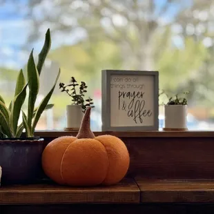 a pumpkin on a window sill