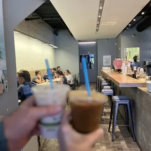 a person holding a drink