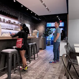 two people standing at a counter