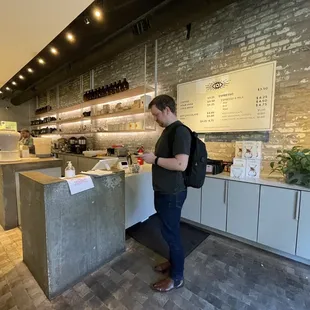 a man standing in a coffee shop