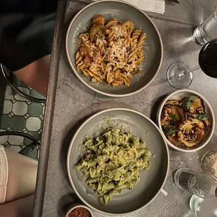 three plates of food on a table