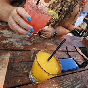 Cheers!!! Spicy Hibiscus Marg (pink &amp; delish) with the Mango Frozen Lemonade marg (peachy and refreshing)