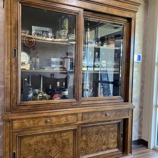 a display cabinet with glass doors