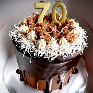 the number 70 on top of the cake