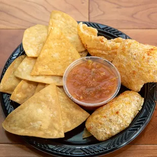 a plate of chips and salsa