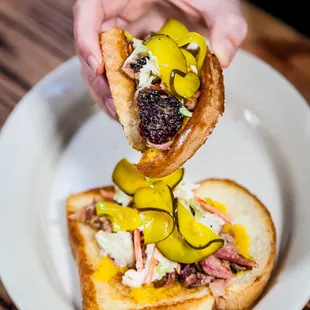 Happy Hour Carolina Clamshell.  Smoked Pork, Slaw, Zucchini Pickles, Toasted White Bread.