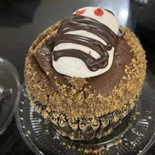 a cupcake with chocolate frosting