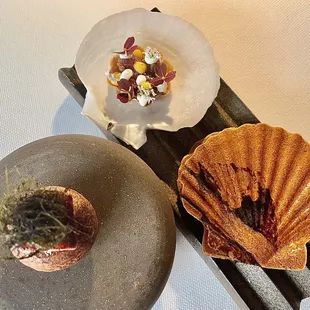 Clockwise from Top: Tart, XO, Coriander Diver Scallop, Sunchoke, Black Trumpet, Kumquat Maine Donut, Eel, Carrot &amp; Uni Caramel