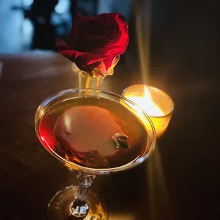 a rose in a martini glass