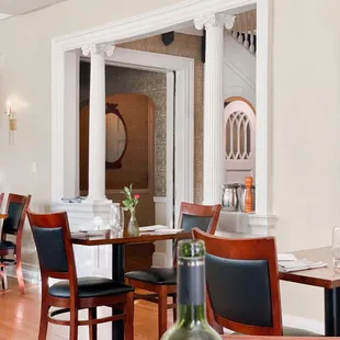 a dining room with tables and chairs
