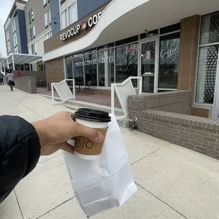 Small Ethiopian macchiato with a chocolate chip scone