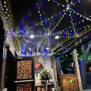 a patio with string lights